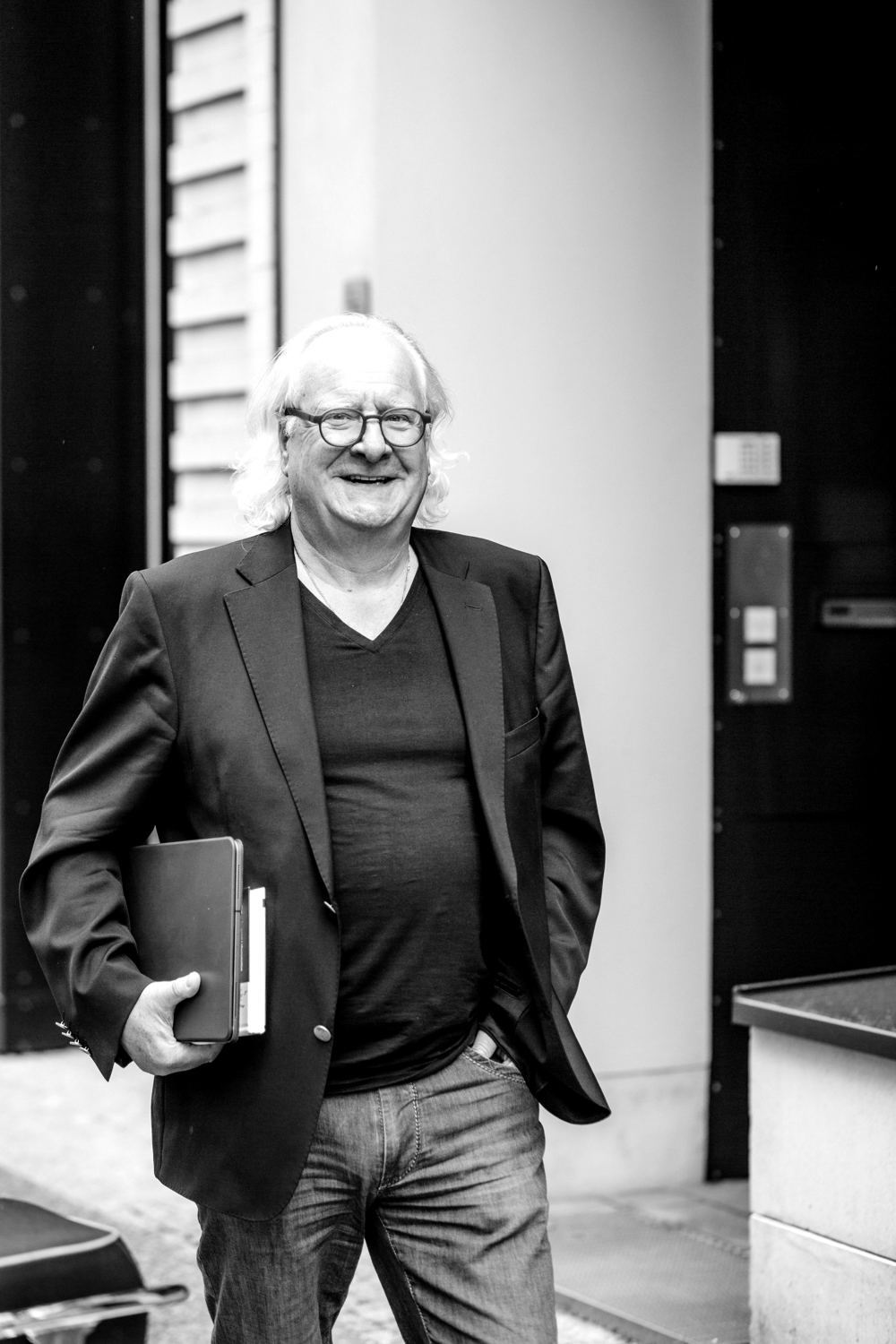 Brunello Gianella, laughing, with a tablet under his arm